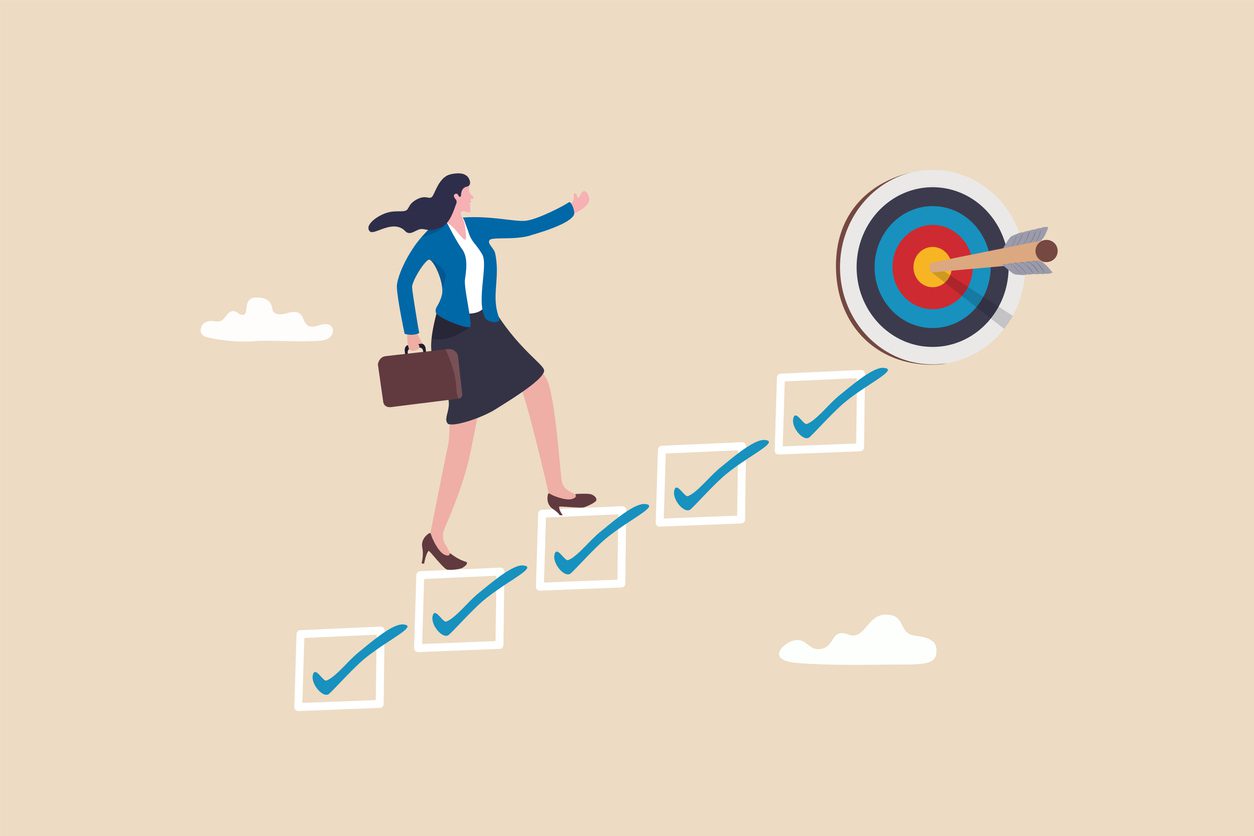 consistent habits help build success a woman climbs a set of checkboxes to reach a bullseye target