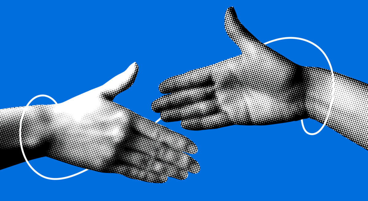 Two black and white hands reach out to shake on a blue background.